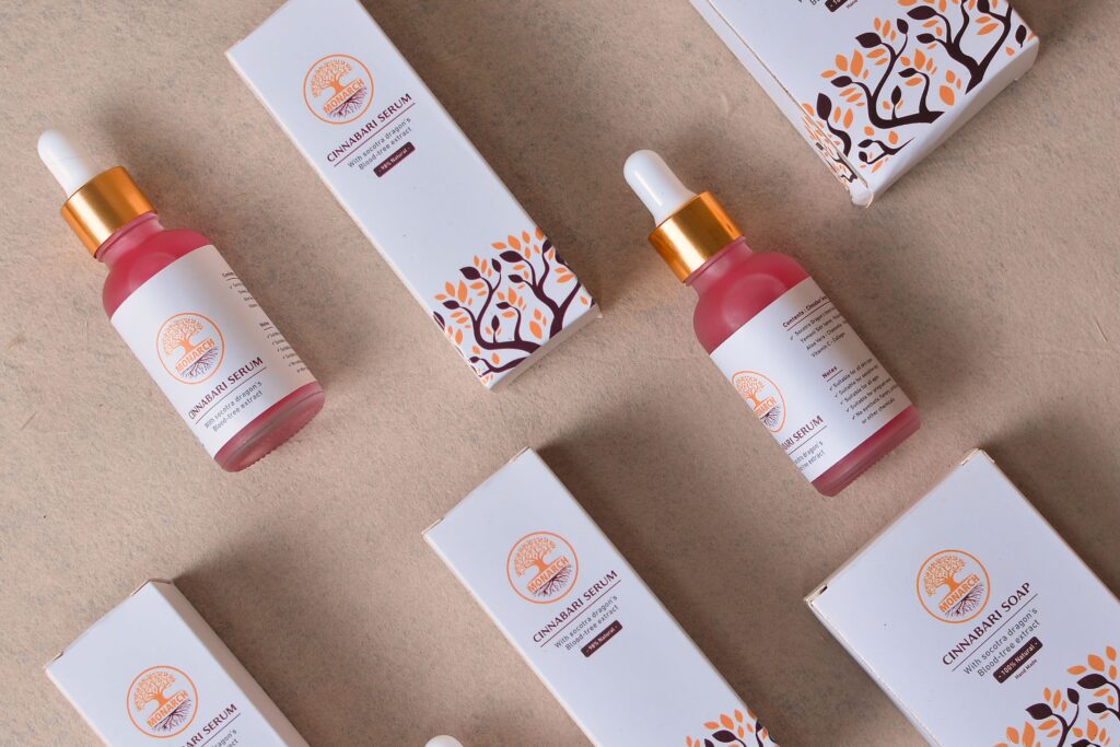 Flat lay of cosmetic serum bottles and boxes for beauty and skincare.